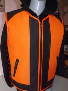 Biker vest.Textile: orange with black.Orange leather finish. Two external pockets and two inside pockets. Camouflage textile+ genuine leather. I will make vests from S.. to 5X size. The customer can change the style of the vest according to his taste. Leather braid, accessories (clips, zippers, pockets, everything can be changed). Made by designer and leather tailor with experience of 30 years. There can be produced in any size and model take 4-6 days. Order can be any size from S to 5X. The lea Sleeveless Sweaters, Braid Accessories, Sweater Vest Mens, Sleeveless Jumper, Biker Vest, Leather Finish, Biker Leather, Orange Leather, Leather Vest