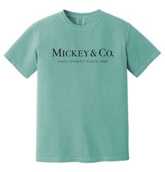 Mickey & Co. Main Street Since 1928 The design showcases  a fun shirt design of Mickey & Co. Main Street Since 1928 embroidered . This is the perfect t-shirt for any Mickey fan. Embroidery Location: Front of Item (full chest) The Unisex Garment-Dyed Heavyweight T-Shirt | Comfort Colors is the go-to choice for those who appreciate a structured-fit shirt, made from a thick but breathable material. The 100% cotton fabric is super soft and ensures comfy wear whatever the occasion.      100% ring-spu Vintage Cotton Shirt With Logo Print, Classic Short Sleeve Shirt With Logo Print, Classic Cotton Shirt Pre-shrunk, Classic Cotton Shirt With Letter Print, Classic Short Sleeve Pre-shrunk Shirt, Classic Cotton Pre-shrunk Tops, Vintage Cotton Top With Branding, Classic Crew Neck Shirt With Graphic Print, Vintage Cotton T-shirt With Branding