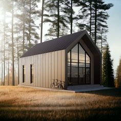 a small house in the middle of a field with a bicycle parked next to it