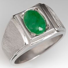 This awesome mens ring is centered with one (1), bead set, oval cabochon cut natural jadeite jade. The shoulders of the ring feature a Florentine finished with step-down bright polished edges. The ring measures 12.1mm at the top, rises 6.6mm above the finger, tapering to 4.0mm wide and 1.2mm thick at the base of the shank. The ring is currently a size 8. Jade Rings Men, Fine Jewelry White Gold Jade Ring, Mens Jade And Gold Ring, Jade Rings With Polished Finish In Oval Cabochon Shape, Carved Green Jade Rings, Jade Ring, Cabochon Ring, Oval Rings, Men's Jewelry Rings