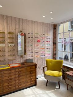 Shop interior interiors boutique store independent shop Optometry Practice, Optical Display, Yellow Armchair, South Of England, Optical Design, Shop Inspiration