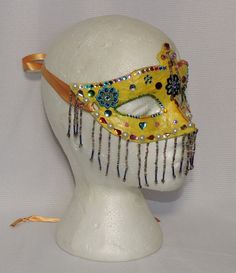 "Beaded masquerade ball mask OOAK - Mardi Gras - Carnival - Halloween - costume mask These wonderful & whimsical beaded masks are handcrafted & all each one is a unique and One of a Kind (OOAK) piece. These are not only great as art to be displayed on a wall or shelf, but also made sturdy enough to be used for costume purpose. One size fits most adults These masks are created using mask blanks that I have covered with several layers of tissue paper & decoupage. They have been further Fitted Masquerade Mask For Halloween Costume Party, Carnival Costume Masks And Prosthetics, Multicolor Costume Accessories For Halloween, Fitted Fantasy Costume Accessories For Carnival, Multicolor Costume Accessories For Carnival And Halloween, Multicolor Halloween Masquerade Masks And Prosthetics, Fitted Costume Accessories For Mardi Gras, Multicolor Masks And Prosthetics For Halloween Masquerade, Fitted Costume Accessories For Carnival And Halloween