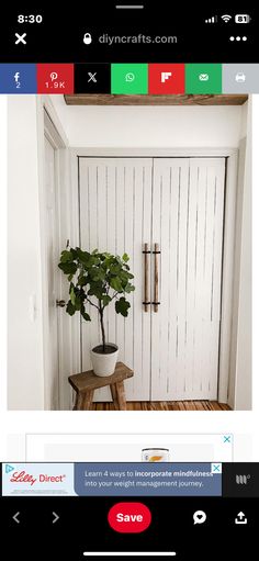 a small potted plant sitting on top of a wooden table next to a door