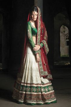 a woman in a green and white lehenga