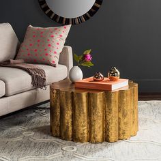 a living room scene with focus on the coffee table and sofa in the foreground