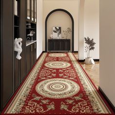 the hallway is decorated with red and gold rugs