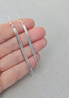 Beautiful bright silver 3 strand snake chain earrings. The ear wires are sterling silver and the snake chain is bright shiny rhodium silver plated brass. The length is 3 inches from the top of the ear wire. Same earrings in Silver with 5 strands https://etsy.me/2t8qQup Same earrings in Yellow Gold with 3 strands https://www.etsy.com/listing/655833140/long-gold-tassel-earrings-graduated-3?ref=shop_home_active_1 Same earrings in Rose Gold with 3 strands https://etsy.me/2sXEjWR Same earrings in Ros Silver Dangle Linear Earrings With Box Chain, Silver Box Chain Dangle Linear Earrings, Silver Long Drop Box Chain Earrings, Silver Long Drop Threader Earrings, Long Earrings Silver, Earrings Long Silver, Earrings Tassel, Gold Tassel Earrings, Long Silver Earrings