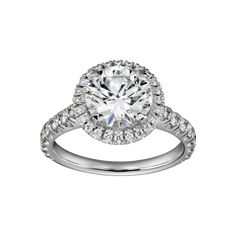 a white gold engagement ring with an oval cut diamond surrounded by round brilliant pave diamonds