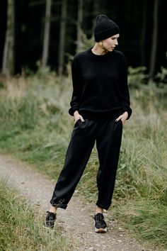 BOOI - black woollen trousers. The cut is quite wide. Tapered legs are ideal for rolling up and controlling the length this way. Rubber in the waist allows wearing the trousers both on the hips and in the waist. Pockets on the sides. The trousers are made of black wool that is slick and doesn't irritate the skin. They reflect light beautifully. Because of the addition of elana and lycra, the trousers don't crease easily and are easy to maintaint. Color: black Fabric: 100% wool Made in Belgium. Oversized Wide Leg Pants For Fall Workwear, Chic Black Wool Wide Leg Pants, Black Wool High-waisted Wide Leg Pants, Black High-waisted Wool Wide Leg Pants, Chic Black Wool Pants, Chic Black Wool Bottoms, Fall Season Wide Leg Trousers, Oversized Black Winter Pants, Black Wool Wide Leg Pants For Work