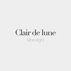 the words clair de lune moonlight are in black and white, against a light gray background