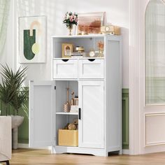 a white cabinet with drawers in a room