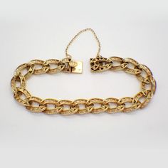 "Vintage French 18k (.750) yellow gold chain bracelet, made of wide open-work design oval form links with a box type closure and safety chain. This majestic bracelet is 7 1/4\" long, 9.8 mm wide and weighs 25 grams. EA3539" Luxury Gold Oval Link Bracelet With Box Chain, Luxury Oval Link Box Chain Bracelet, Luxury Gold Bracelet With Adjustable Oval Link Chain, Luxury Elegant Gold Oval Link Bracelet, Gold Engraved Link Chain Bracelet, Formal Gold Figaro Chain Bracelet, Gold Engraved Oval Link Chain Bracelet, Formal Figaro Chain Bracelet With Oval Link, Engraved Oval Link Yellow Gold Bracelet