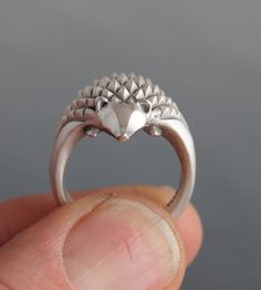 who doesn't love hedgehogs. so prickly when they are curled up and so cute when they uncurl in your hand exposing their shy pointy faces. this ring is sterling silver Satin finished with a polished head and part of the band. there is also a listing with eyes Silver Hedgehog, Luna Cat, Turtle Ring, Animal Ring, A Hedgehog, Silver Jewelry Design, Funky Jewelry, Hedgehogs, Jewelry Designer