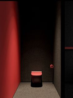 a red toilet sitting in the middle of a room