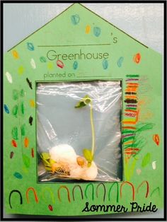 an image of a green house made out of paper and plastic wrap around the frame