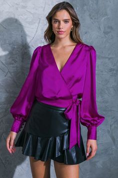 A solid satin top featuring surplice neckline, long puff sleeve with pleated detailed cuff, side tie and smocked back waist band. Self : 100% Polyester Size & Fit - Model is 5`8" And Wearing Size Small Measurements Taken From Size Small - Approx. Length: 19" Visor Hairstyles, Blue Wine Glasses, Surplice Neckline, Judy Blue Jeans, Satin Top, Long Puff Sleeves, Vintage Inspired Design, Tie Top, Summer Hats