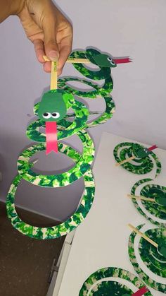 someone is making a snake out of paper