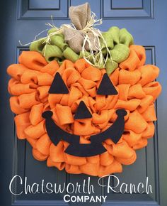 an orange wreath with a black jack - o'- lantern on it and the words chatswothh ranch company