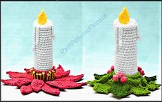 two crocheted candles sitting next to each other on top of leaves and flowers