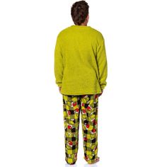 Get ready to steal the show this holiday season with this pajama set. Whether you are a fan of Dr. Seuss' classic character or looking for cozy and festive PJs, this choice is great. This plush fleece set features a green top with an embroidered Grinch face on the front and black and green Santa plaid bottoms. Made with great materials, this sleep set is designed for both comfort and durability. The soft fabric feels gentle against your skin, while the meticulous stitching ensures that your Grin Grinch Pajamas, Dr Seuss Grinch, Grinch Santa, The Grinch Movie, Grinch Who Stole Christmas, Grinch Face, Green Santa, Family Pajama Sets, Mens Pajama Pants