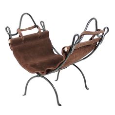 a chair that is sitting on a metal stand with a brown bag in the back