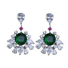 Emerald and Diamond earrings showcase a beautiful dark green stone surrounded by sparkling CZ diamonds. With their modern yet classic design, these statement hangings are both cute and elegant, making them a perfect wedding or anniversary gift. Ideal for adding a touch of sophistication to any special occasion. *𝐏𝐑𝐎𝐃𝐔𝐂𝐓 𝐃𝐄𝐓𝐀𝐈𝐋* * 𝐌𝐚𝐭𝐞𝐫𝐢𝐚𝐥: Brass * 𝐏𝐥𝐚𝐭𝐢𝐧𝐠: White Rhodium Plated * 𝐒𝐭𝐨𝐧𝐞: AAA-quality CZ diamond, Emerald. *𝐃𝐈𝐌𝐄𝐍𝐒𝐈𝐎𝐍𝐒* * 𝐖𝐞𝐢𝐠𝐡𝐭: 1.50 g Modern Classic Wedding, Emerald And Diamond Earrings, Green Stone Earrings, Cz Jewelry, Earrings Green, Earring Jewelry, Cz Diamond, Green Stone, Photographic Lighting