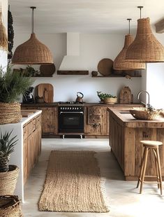 a kitchen with lots of wooden cabinets and hanging baskets on the wall above it, along with an area rug in front of the stove