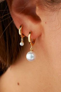 Pearl Huggie Earrings - Endless stacking options with our mini pearl huggies. Made for layering and perfect for sensitive ears. A flawless addition to your OOTD and your new low-key staple piece. Earrings, Pearl Earrings, Huggies Earrings, Gold earrings, Women's Jewelry, Casual Gold Jewelry, Jewelry Fashion, Earrings for her! #earrings #goldearrings #jewelryideas #rellery Everyday Hoop Earrings With Pearl Charm, Everyday Small Hoop Huggie Earrings With Pearl Drop, Small Hoop Huggie Earrings With Pearl Drop, Everyday Small Huggie Earrings With Pearl Drop, Pearl Charm Huggie Earrings, Everyday Huggie Earrings With Pearl Charm, Classic Huggie Jewelry With Pearl Charm, Dainty Huggie Earrings With Pearl Charm For Everyday, Minimalist Everyday Pearl Huggie Earrings