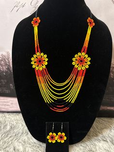 Beautiful set of necklace and earrings handmade by Mexican artisans. Traditional Orange Multi-strand Jewelry, Handmade Orange Multi-strand Necklace, Multicolor Pendant Jewelry Sets, Handmade Orange Long Necklace, Handmade Orange Necklace, Handmade Orange Multi-strand Jewelry, Adjustable Necklaces With Matching Earrings, Multicolor Necklaces With Matching Earrings For Gifts, Yellow Dangle Necklaces As Gifts