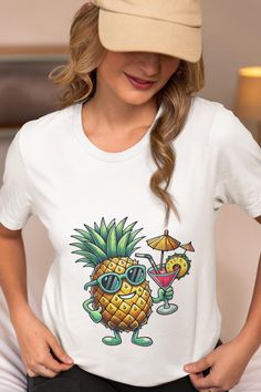 Get into the summer spirit with this vibrant unisex t-shirt featuring a cool pineapple wearing sunglasses and holding a tropical cocktail. Perfect for beach days, vacations, luau parties, or as a fun gift for fruit lovers. Made with soft, lightweight fabric, this tee offers a comfortable fit for any occasion. Whether you're relaxing by the pool or hitting the beach, this shirt is your go-to for showcasing your tropical vibes in style. We utilize the authentic Bella Canvas 3001 brand, renowned for its UNISEX design, making it one of the most sought-after shirts in the market. Prior to placing an order, kindly refer to our size chart. It can be located in both the listing's images and description. This cozy T-shirt serves as an ideal present, suitable for occasions such as birthdays, Christm Fun Beach T-shirt With Sublimation Print, Funny Short Sleeve T-shirt For Beach, Fun Summer T-shirt For Beach Party, White Tropical Print T-shirt For Summer, Summer Tropical Print Short Sleeve T-shirt, Funny Sublimation Print Tops For Summer, Funny Crew Neck Shirt For Summer, Funny Pre-shrunk T-shirt For Summer, Tropical Short Sleeve T-shirt With Graphic Print