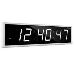 an alarm clock with the time displayed on it's display panel is shown against a white background