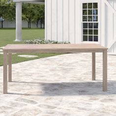 This outdoor dining table makes it easy to gather family and friends for a memorable meal. It's made from solid eucalyptus wood that is naturally water- and weather-resistant, so you can leave it outside if a rainstorm cuts dinner short. Four slim legs support the table, while the planked tabletop has an umbrella hole that lets you keep yourself and your guests in the shade. This table measures 71" long, so you can sit six people comfortably. Birch Lane™ Bowens Wooden Dining Table - Tables in Br Solid Wood Side Table, Concrete Dining Table, Teak Side Table, Wooden Dining Table, Metal Dining Table, Eucalyptus Wood, Teak Dining Table, Metal Side Table, Patio Dining Table