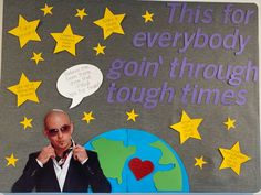 a man with sunglasses on standing in front of a bulletin board