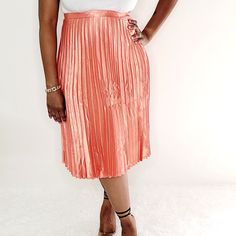 Pleated Knee Length Skirt Side Zipper 100% Polyester Model Wearing Large Spring Pleated Midi Skirt For Night Out, Spring Midi Pleated Skirt For Night Out, Spring Night Out Pleated Midi Skirt, Spring Night Out Midi Length Pleated Skirt, Elegant Orange Skirt For Spring, Summer Midi Pleated Skirt For Night Out, Chic Summer Pleated Pencil Skirt, Chic Orange Skirt For Spring, Summer Stretch Knee-length Pleated Skirt