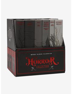 a set of four books sitting on top of each other in a black box with red lettering