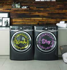 two washers sitting next to each other in a room