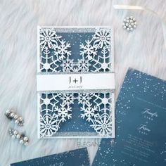 three cards with snowflakes on them sitting next to each other