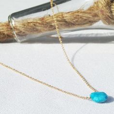 This turquoise necklace has a faceted turquoise gemstone that sits on a dainty 14k gold filled, sterling silver or 14k gold chain and lays below the collarbone. Subtle and simple, this beautiful semi-precious birthstone necklace is perfect by itself or for layering with other necklace. Turquoise is a December birthstone. Tiny seed pearls adorn the clasp giving the necklace a beautiful touch.  All necklaces are handmade by me in NYC and each necklace is made to order for you with only the hig... Dainty Yellow Gold Turquoise Necklace For Gift, Turquoise Faceted Briolette Necklaces, Turquoise Faceted Briolette Necklace, Dainty Turquoise Jewelry In 14k Gold Filled, Dainty 14k Gold-filled Turquoise Jewelry, Dainty 14k Gold Filled Turquoise Jewelry, Sterling Silver Turquoise Faceted Necklace, 14k Gold Turquoise Necklace For Gift, Minimalist Turquoise Gemstone Necklace