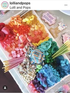 an assortment of lollipops and pops on a tray