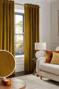 a living room with yellow curtains and a white couch