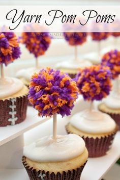 cupcakes decorated with purple and orange flowers on top of each other in front of the words yarn pom poms