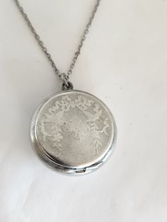 Beautiful sterling silver antique locket pill box. Lined in a soft white gold. Marked sterling. Approximately 3/4 of an inch across. hinged lid snap shut. 18-in chain Silver Necklace Locket, Silver Locket Aesthetic, Twd Oc, Antique Locket, Silver Locket, Locket Pendant Necklace, Silver Lockets, Pill Boxes, Purse Accessories