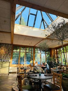 the inside of a restaurant with tables and chairs