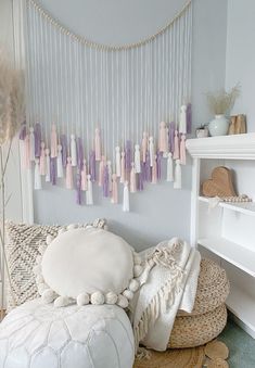 a living room filled with lots of white furniture