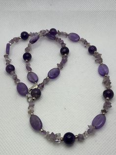 "18.1g Lobster 925 19\" 3/8 to 1/4 to 1/8 Round, oval, nugget chips, Sterling spacers This is a vintage, genuine purple amethyst and sterling silver necklace. The necklace is about 19 inches. The necklace features gorgeous, deep purple amethyst stones that are oval-cut, round-cut and nugget chips with sterling silver spacers. Very pretty. The necklace is about 3/8\" in width at the widest point then is 1/4\" and 1/8\" in width at other points. It weighs about 18.1 grams and is stamped 925. A sho Silver Amethyst Single Strand Necklace, Silver Amethyst Necklace With Single Strand, Silver Single Strand Amethyst Necklace, Purple Necklace Stamped 925 As Gift, Amethyst Purple Necklaces Stamped 925, Purple Amethyst Necklaces Stamped 925, Amethyst Stones, Necklace Ideas, Sterling Necklaces