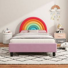 a child's bedroom with a rainbow bed frame