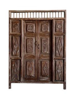 an old wooden door with ornate carvings on the front and side panels, isolated against a white background