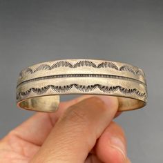 Vintage Navajo Native Stamp Work Sterling Silver Bracelet Cuff 6-1/2". Inner measurement from end-to-end is 5-3/4", with a 3/4" gap. Total inner circumference is 6-1/2". ---------------------------------------- All items, unless stated otherwise, are previously loved and used, showing scratches and slight imperfections (not brand new). Please refer to pictures for condition as they depict what you'll receive. If you have any questions, ask before purchasing. Note:   - Size and weight are approximate.   - "Vintage" is based on look and feel; items may be older (pre-1930s) or newer (post-1980s/1990s).   - We're not experts on stones. Refer to pictures for type and quality.   - "Southwestern" items reflect that style, possibly from Navajo, Zuni, Hopi, etc.   - "Sterling" items are tested to b Vintage Navajo Jewelry Gold, Southwestern Hallmarked Silver Jewelry, Sterling Silver Cuff Bracelet Native American, Vintage Navajo Earrings, Southwest Jewelry Navajo Silver Cuff Bracelets, Vintage Navajo, Silver Cuff Bracelet, Native American Jewelry, Sterling Silver Bracelets