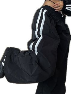 Retro Winter Streetwear Bottoms, Trendy Black Gym Pants, Trendy Streetwear Activewear Long Pants, Trendy Baggy Pants For Sports, Baggy Black Pants For Workout, Baggy Black Workout Pants, Trendy Baggy Sweatpants For Sports, Black Baggy Pants For Workout, Stretch Parachute Pants For Hip Hop Streetwear