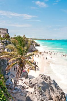 people are on the beach and in the water at this tropical resort near canculla, mexico